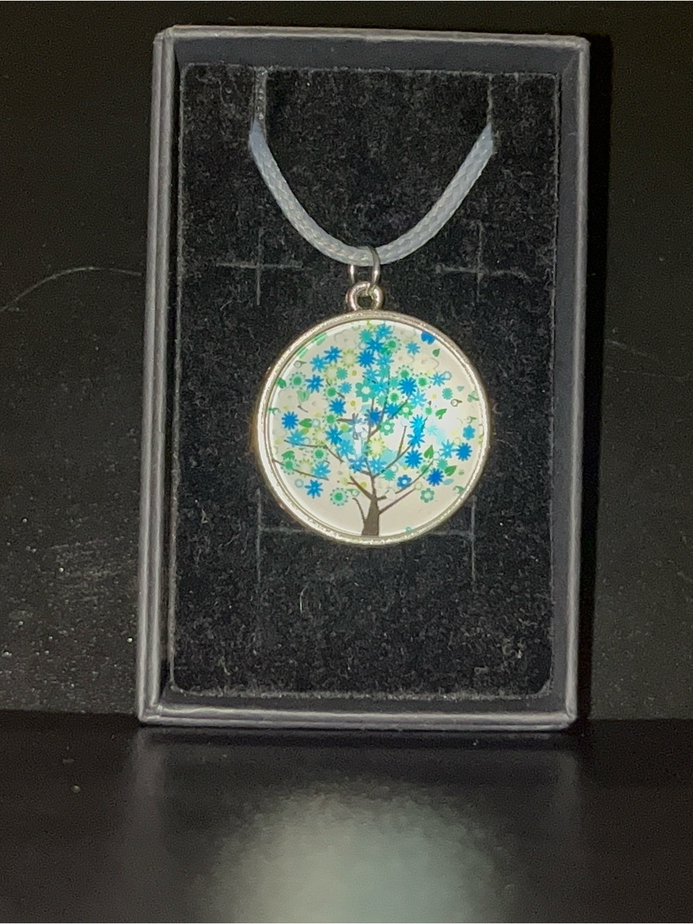 Silver Round Pendant Necklace with Blue Floral Tree Design